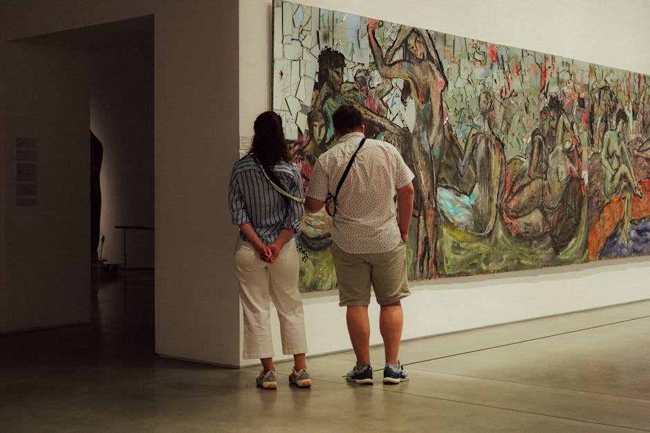 Two adults observe a large abstract painting in a modern art museum gallery.